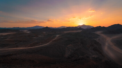 Egypt desert with mountains at sunset