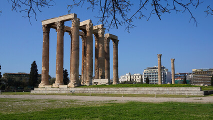 Photo of iconic pillars of Temple of Olympian Zeus with view to the Acropolis and the Parthenon,...