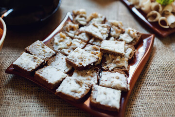 Snacks made of bread and leaf lard served on brown plate