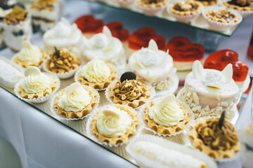Baskets with chocolate cream and nuts served on mirror dish
