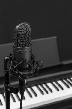 condenser microphone on piano background, black and white