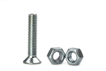 Macro view of shiny metal bolts and nuts isolated on white background with reflection effect