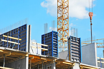 Crane and highrise construction site