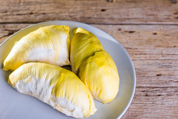 Durian fruit in white container Put on the wooden floor