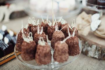 Delicious chocolate sweets served on glass plate