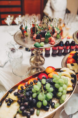 Tired steel dish with grape and other fruits