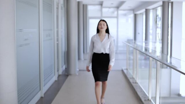 Attractive woman walking ,then stops and cross her arms