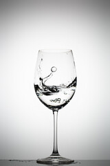 Water splashing in a wine glass