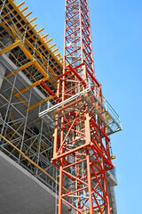 Fototapeta na wymiar Crane and highrise construction site