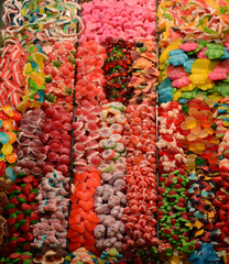 Multicolored sweets on the market counter