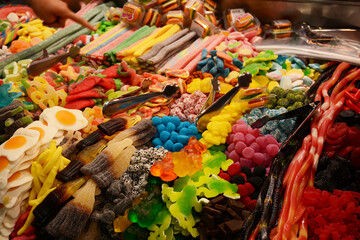 Multicolored sweets on the market counter