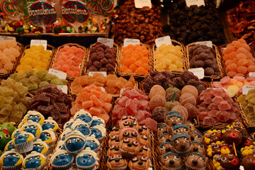 Sweets and marmalade on the counter of the market in Barcelona