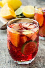 Sangria drink in glass on wooden table
