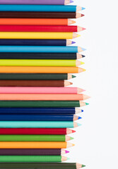 Fototapeta premium colored pencils in an arrangement on a white background