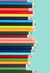 colored pencils in an arrangement on a white background