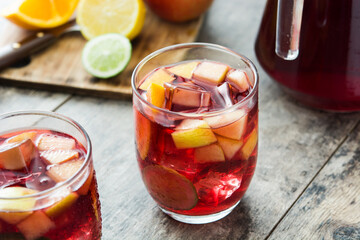 Sangria drink in glass on wooden table
