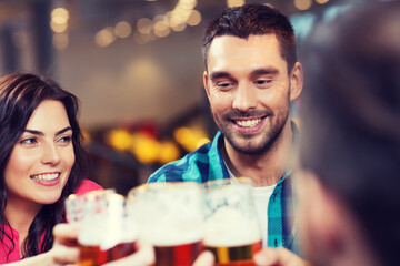 friends dining and drinking beer at restaurant