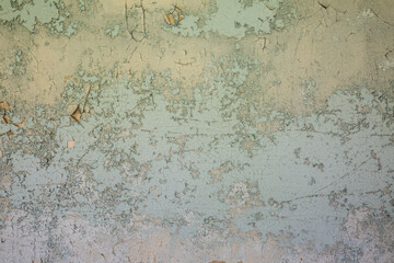 blue peeling paint on aged concrete wall texture