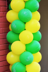 Multicolored balloons adorn the entrance to the cafe