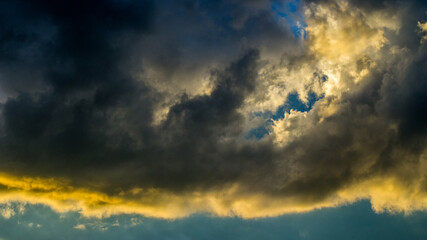 Dramatic sunset sky with colorful clouds after thunderstorm