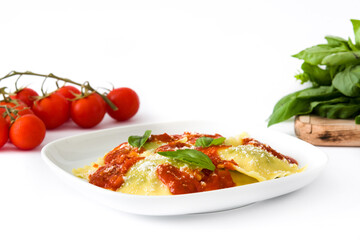 Ravioli with tomato sauce and basil isolated on white background
