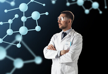scientist in lab coat and goggles with molecules