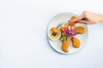 Crispy chicken nuggets with  sauce. Top view