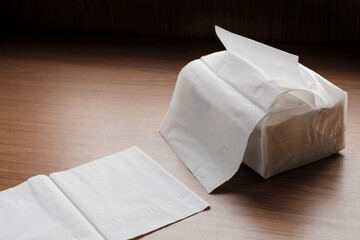 Fototapeta na wymiar Tissue paper / View of tissue paper on wood table.