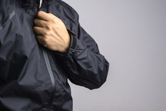 Man Wearing Black Anti Static Or Wet Weather Jacket Or Rain Coat