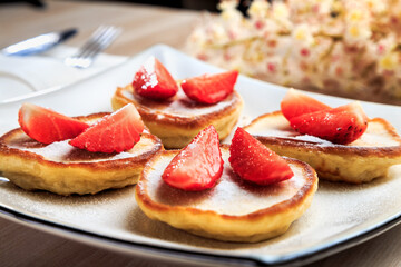 pancakes with strawberry on a plate