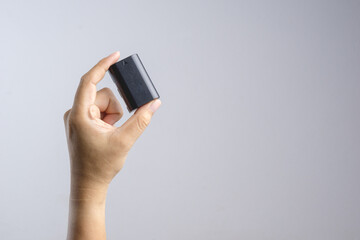 Hand holding camera battery