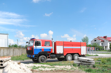 Red Fire Engine. Heavy fire truck moves to the place of fire