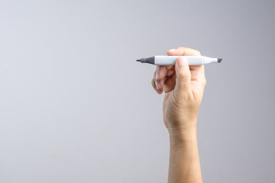 Hand holding gradient level adjustment permanent marker