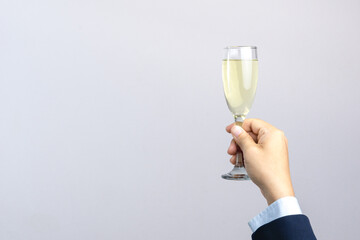 Business man hand holding glass of champagne for celebration