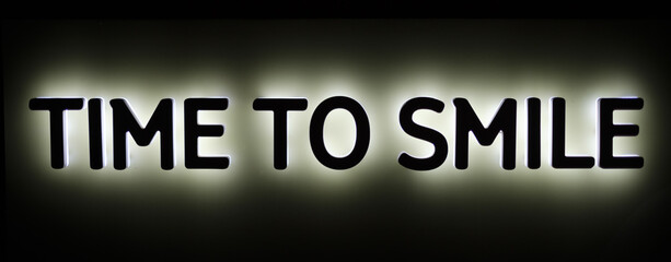 Illuminated text time to smile