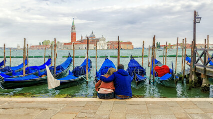 loving couple on the embankment in Venice in the morning