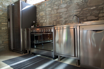 moder inox kitchen in rustic interior