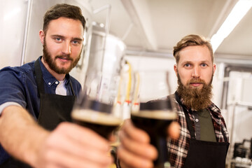 men drinking and testing craft beer at brewery