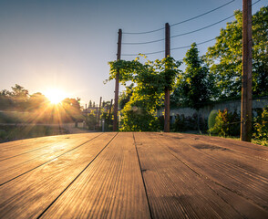 The sun shining on a wooden table in the park.