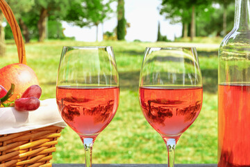 Two glasses of rose wine at picnic with copyspace