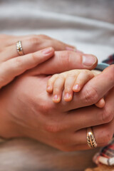 The hands of the family. Baby's hand. Family's love and care.