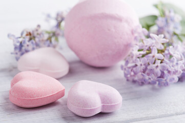 Bath bombs on white wooden background