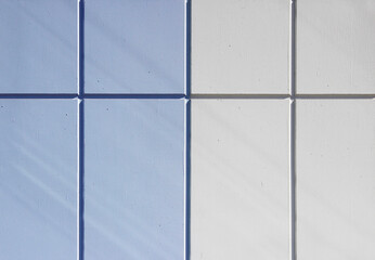 The wall of the house, trimmed with colorful panels, painted in bright colors. Blue and beige