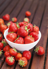 Strawberry on wooden background. Copy space