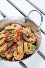 stir fry prawns in spicy asian pineapple and herbs sauce