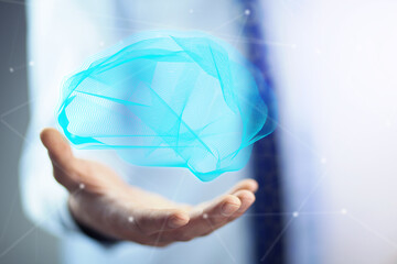 Businessman holding digital human brain