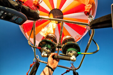 Hot air balloon with gas power accelerators