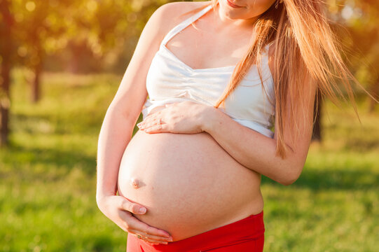 Pregnancy, sport and health lifestyle - young pregnant woman