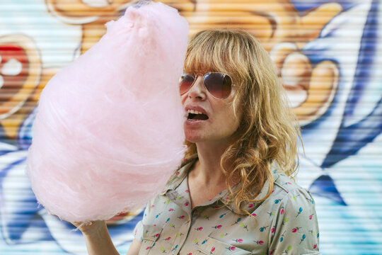 woman with cotton candy in the park