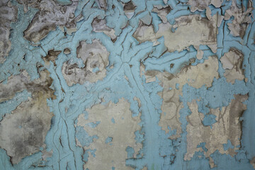 blue peeling paint on concrete wall texture